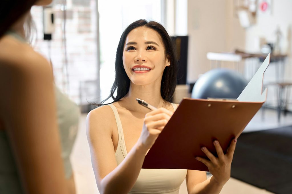 Female trainer giving counseling at the gym